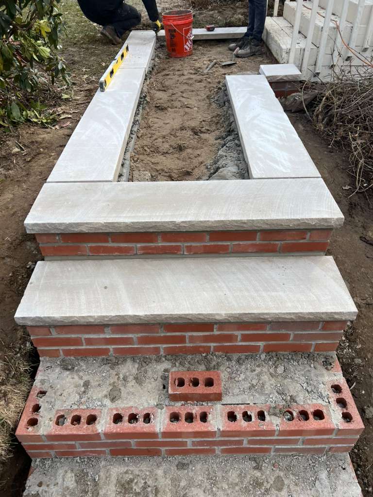 Finished brick and stone masonry on a residential exterior